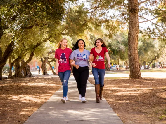 university students walking around campus with UA apparel on